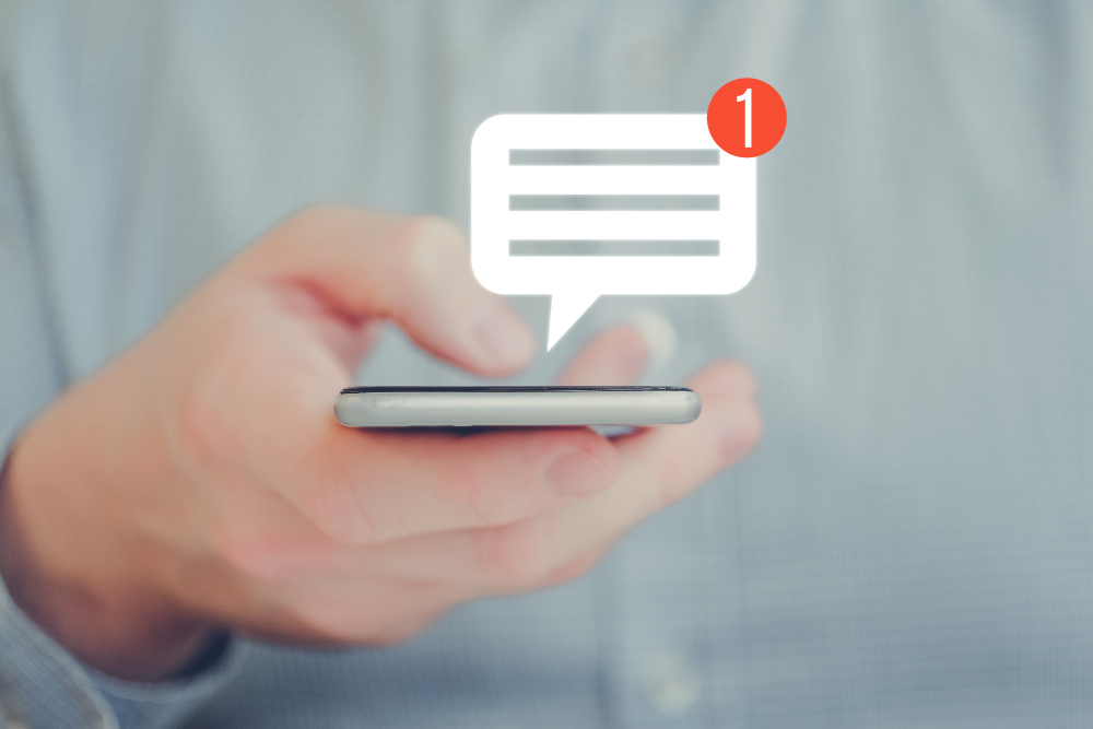 man-shirt-holds-phone-with-his-hand-abstract-notification-message-icon-social-networking-concept