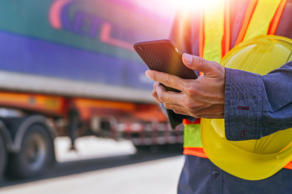 worker-use-smartphones-check-export-items-truck-transport-export-cargo-background